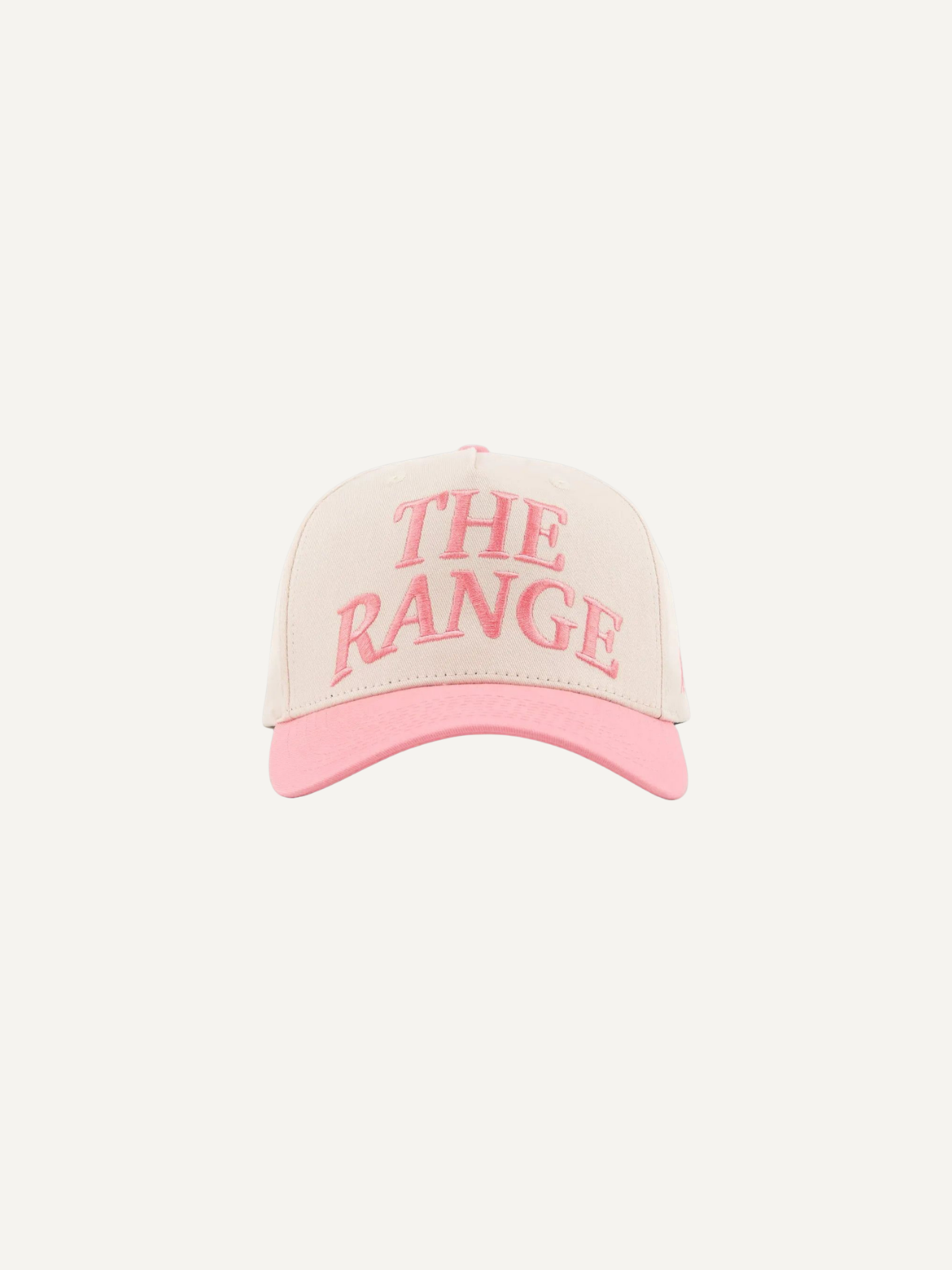 White and pink golf cap with embroidered “The Range” logo, adjustable fit, Inland Grove, front view
