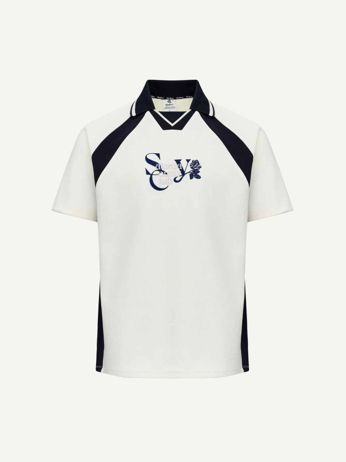 Unisex cream top with navy panel detailing and varsity logo, men’s sizing, front view