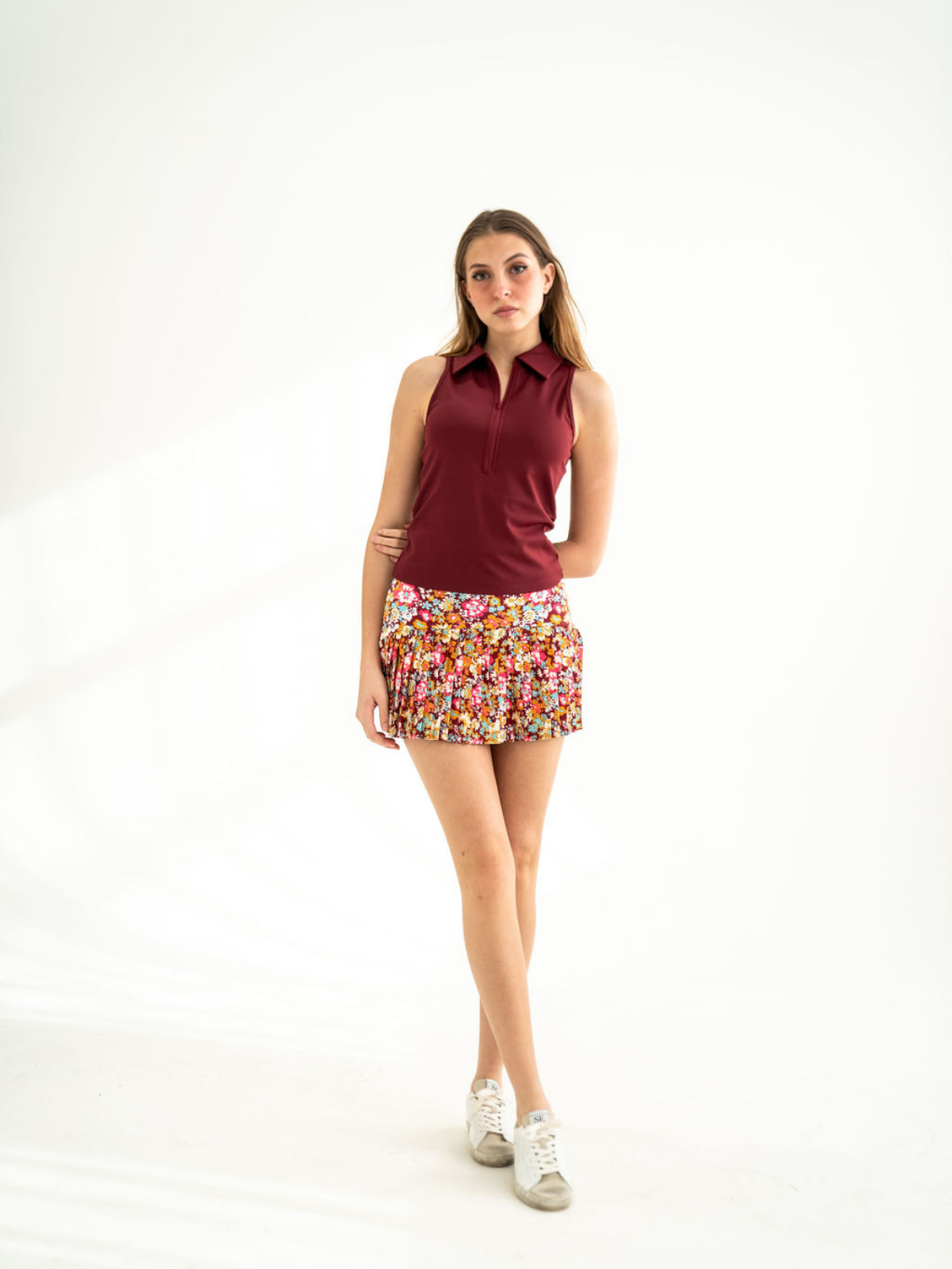 Burgundy sleeveless zip-front polo top with structured collar, Never a Wallflower, front view