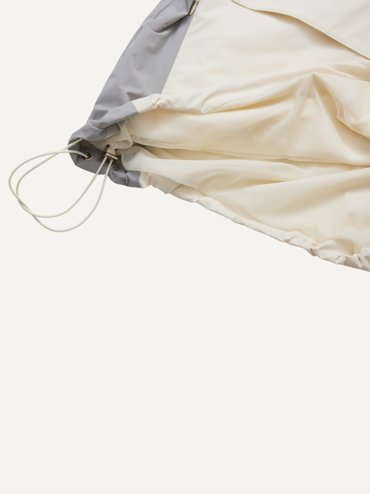 Men’s cream golf windbreaker drawstring hem and fabric detail, Khalhon