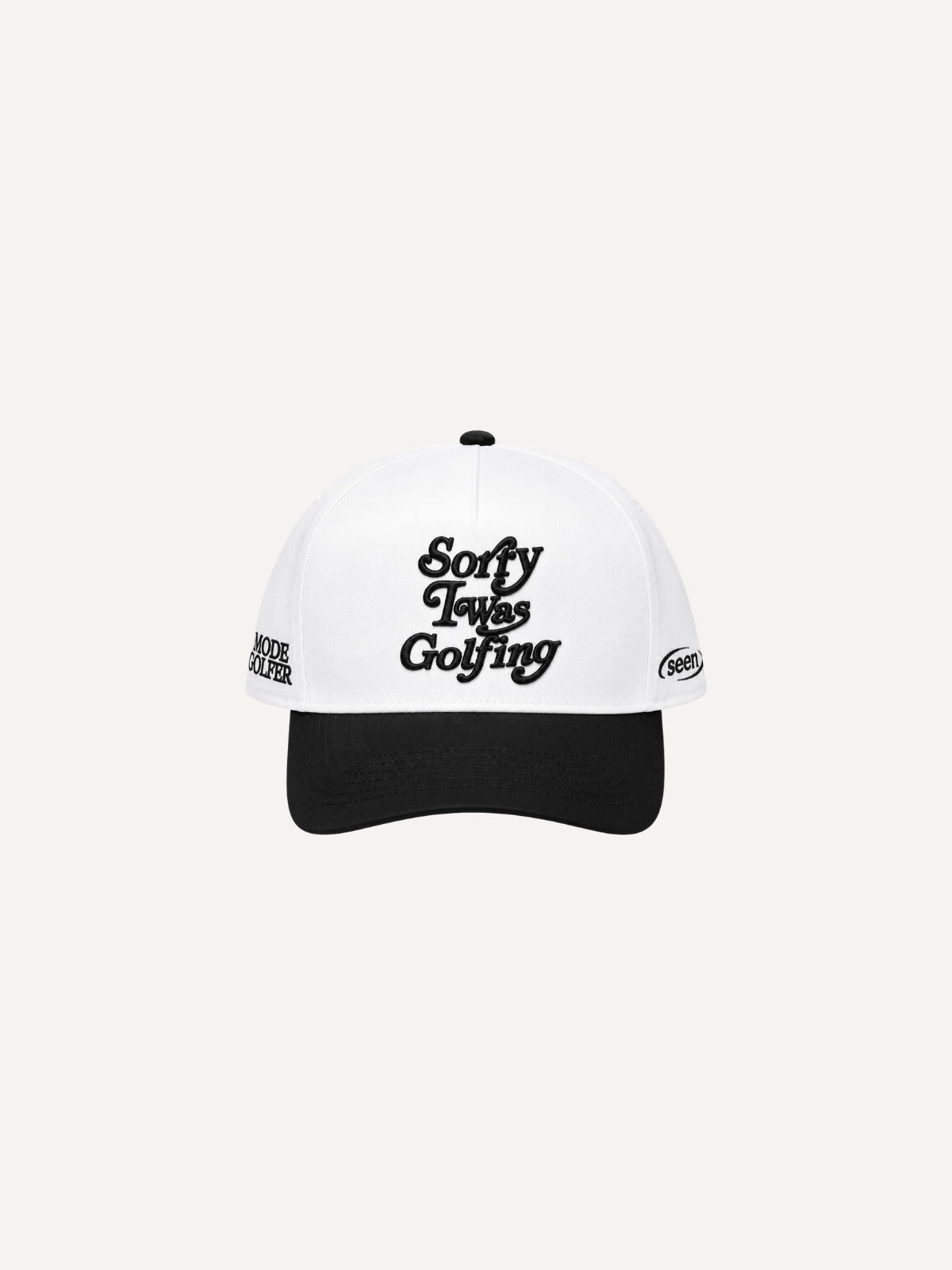 White and black “Sorry I Was Golfing” cap with black embroidery, front view