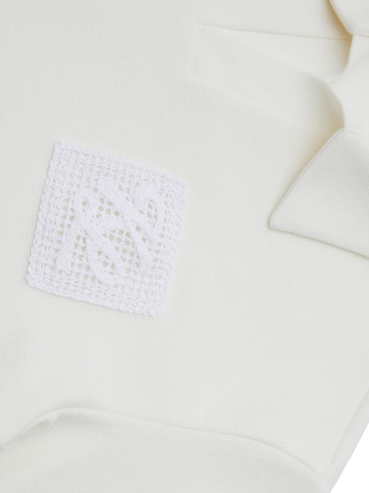 Off-white Needle Emblem soft piqué polo, logo detail view, Khalhon