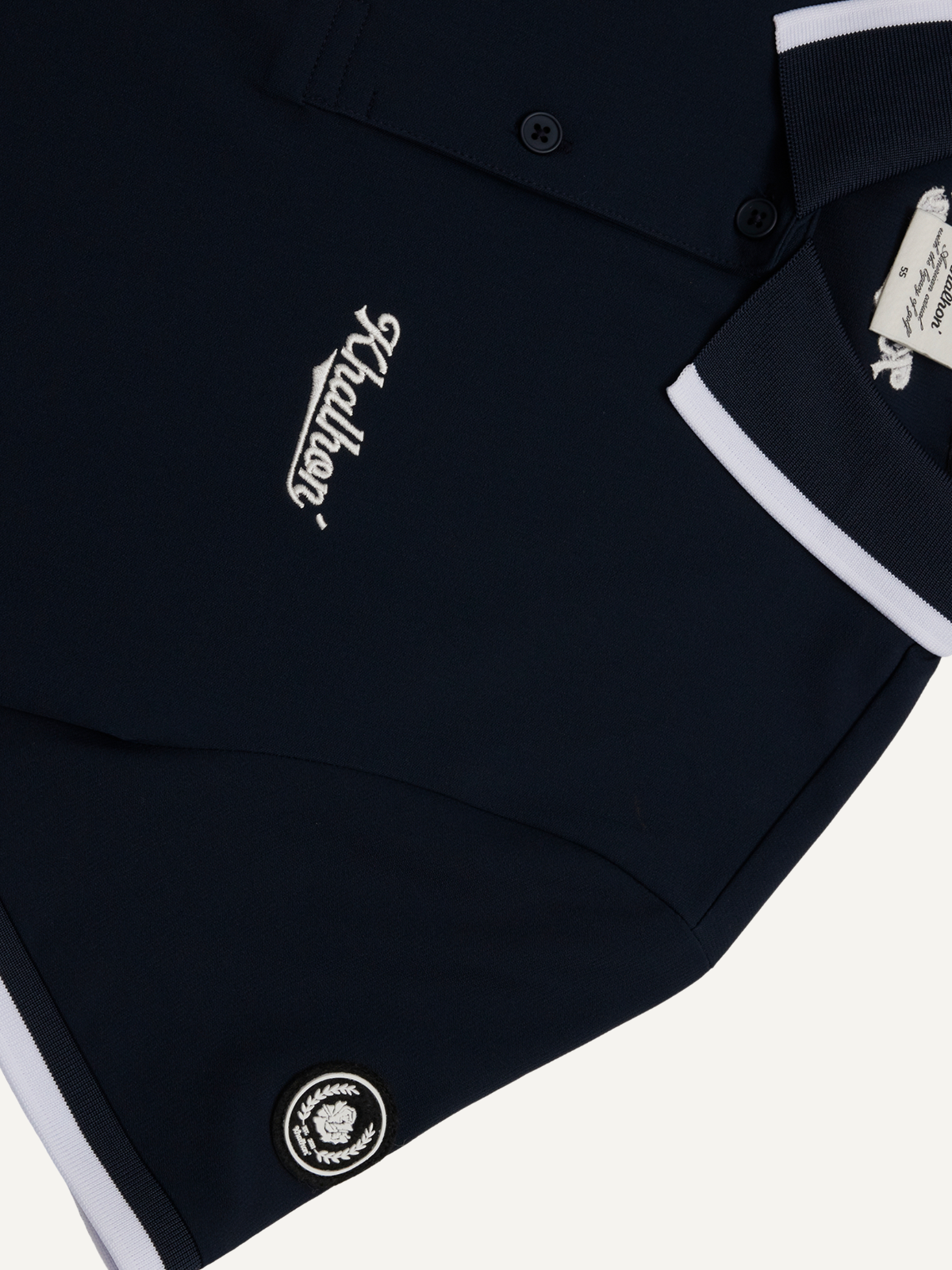 Women’s navy golf polo with embroidered logo and white contrast collar detail, Khalhon