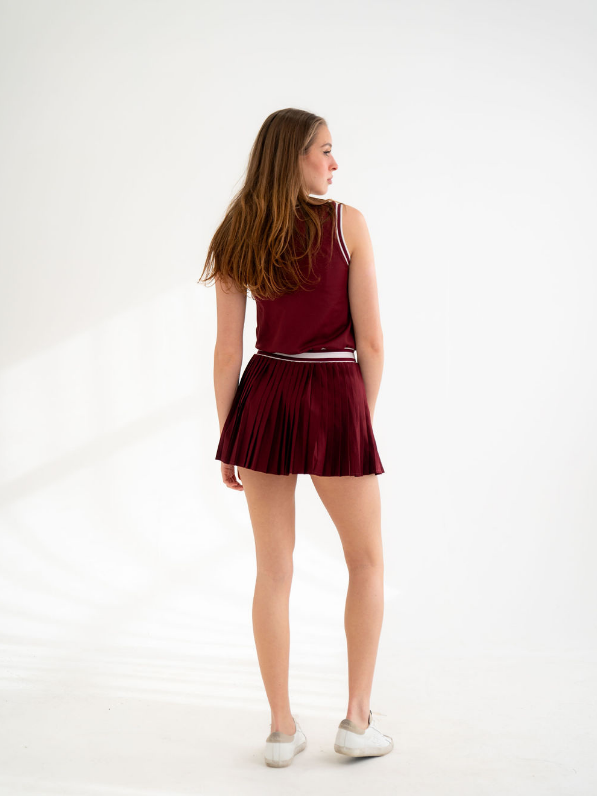 Burgundy dress with pleated skirt and clean back detail, Never a Wallflower