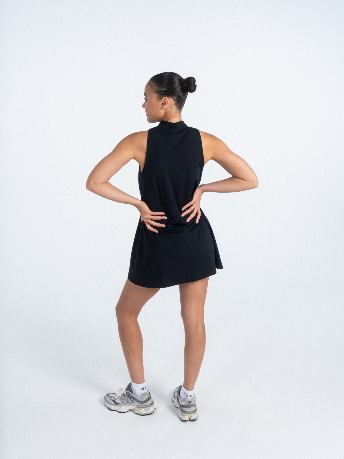 Black sleeveless performance dress, back view, Sierra Madre