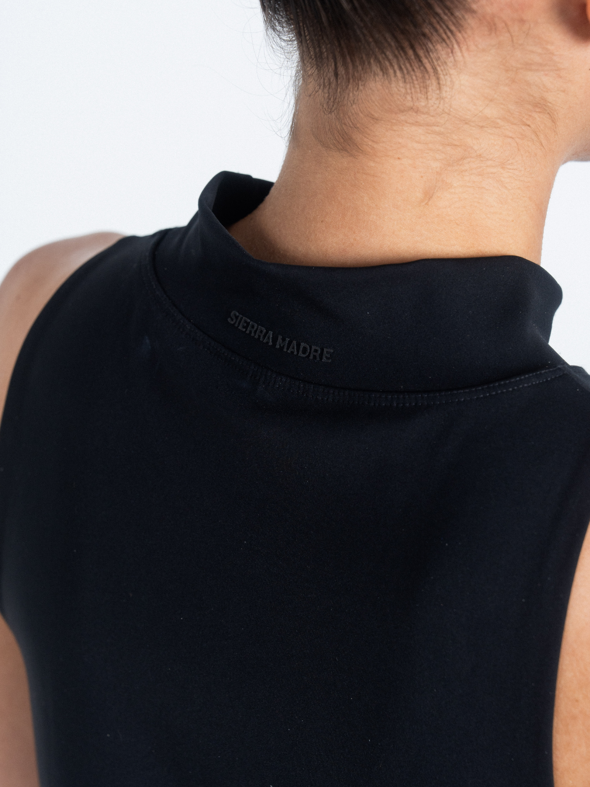 Black dress with Sierra Madre logo embroidered at back collar