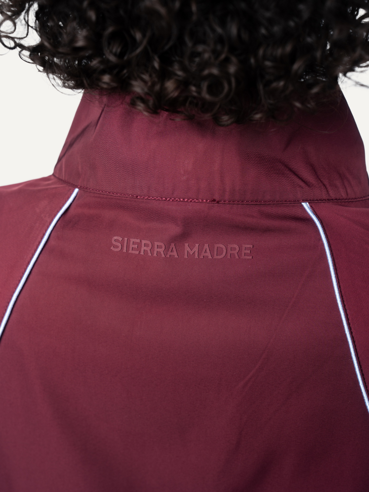Burgundy Unstoppable jacket, back detail with logo, Sierra Madre