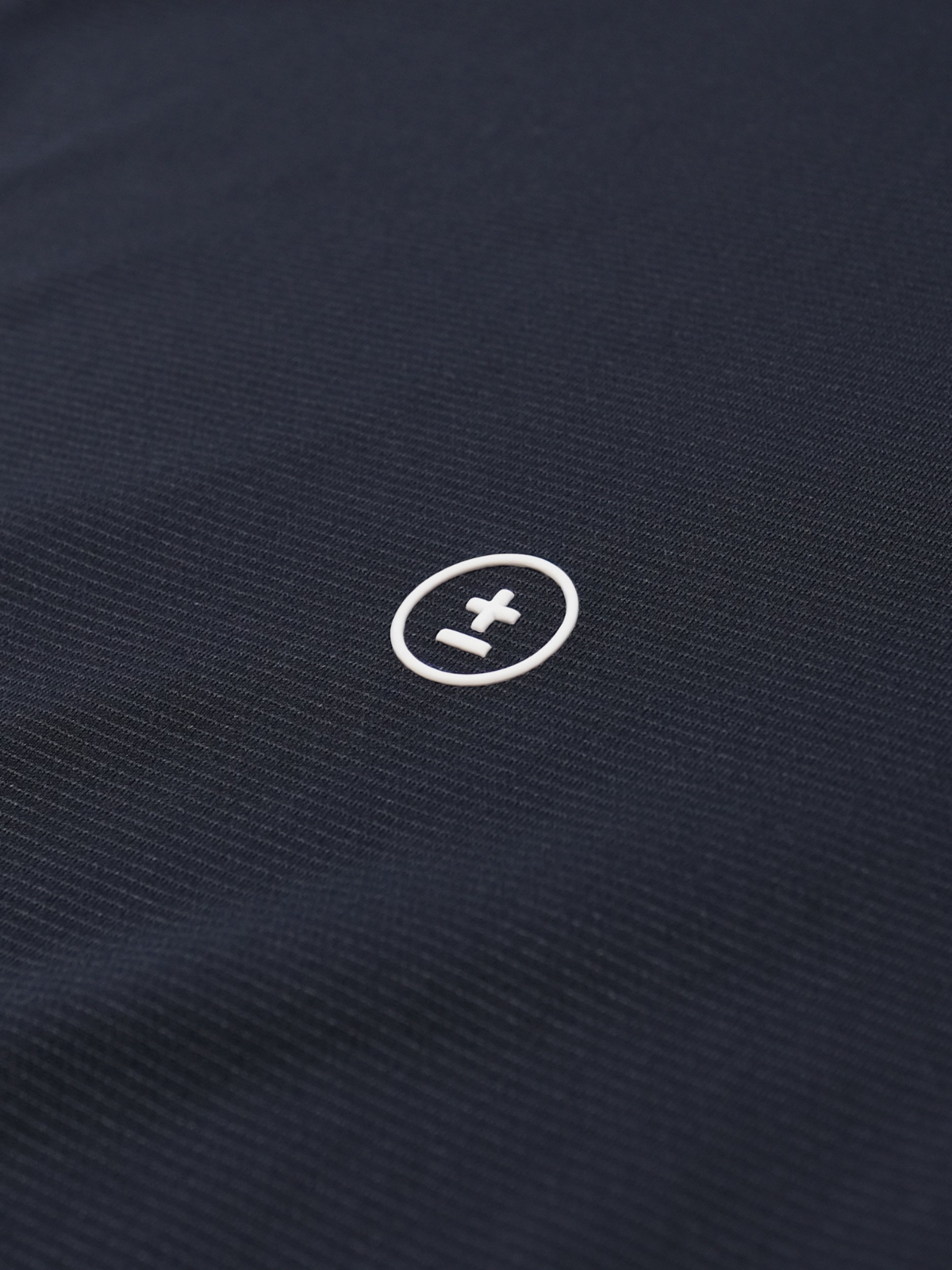 Navy Counselor Polo with embroidered logo and textured weave, Students Golf, fabric detail