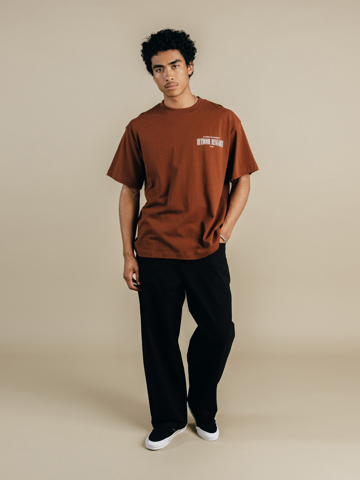 Brown Outdoor Research T-shirt with chest graphic, Students Golf, front view